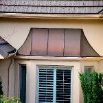 Highly slanted copper roofing for a bay window