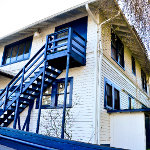 Historic building with custom gutters and downspouts going around the buildings trim